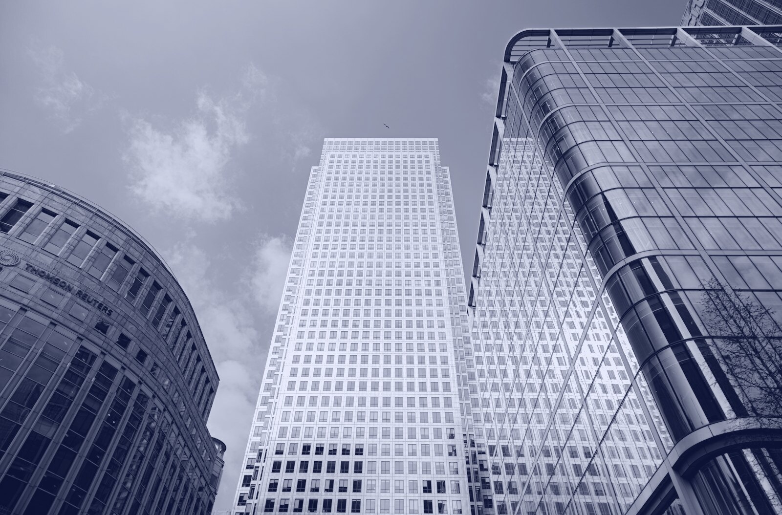 a couple of tall buildings sitting next to each other