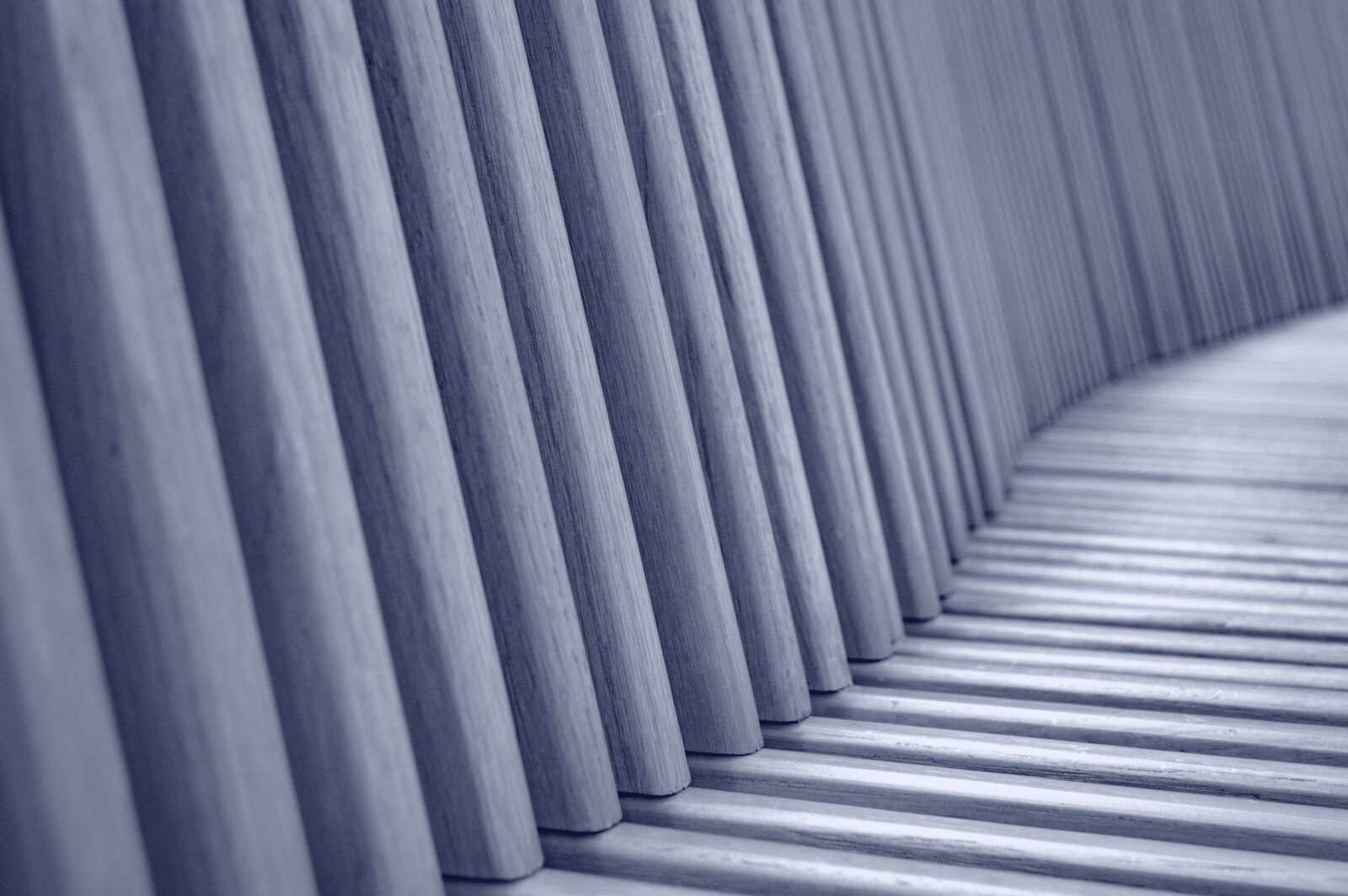 a row of wooden slats lined up against a wall